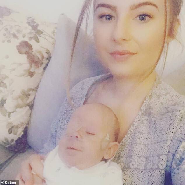 At 23 weeks pregnant, Hanna (pictured with her son) began to experience back pains, and spent four days in labour before giving birth